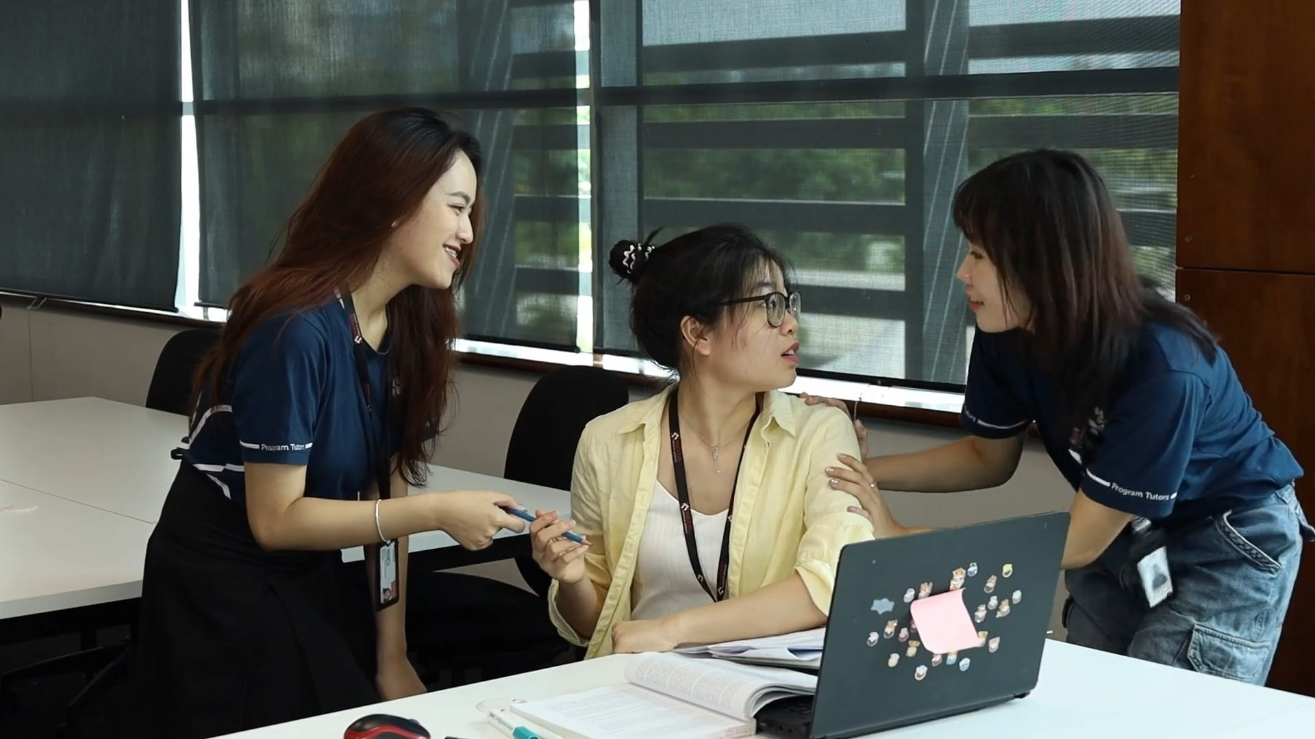 Program tutors helping a student