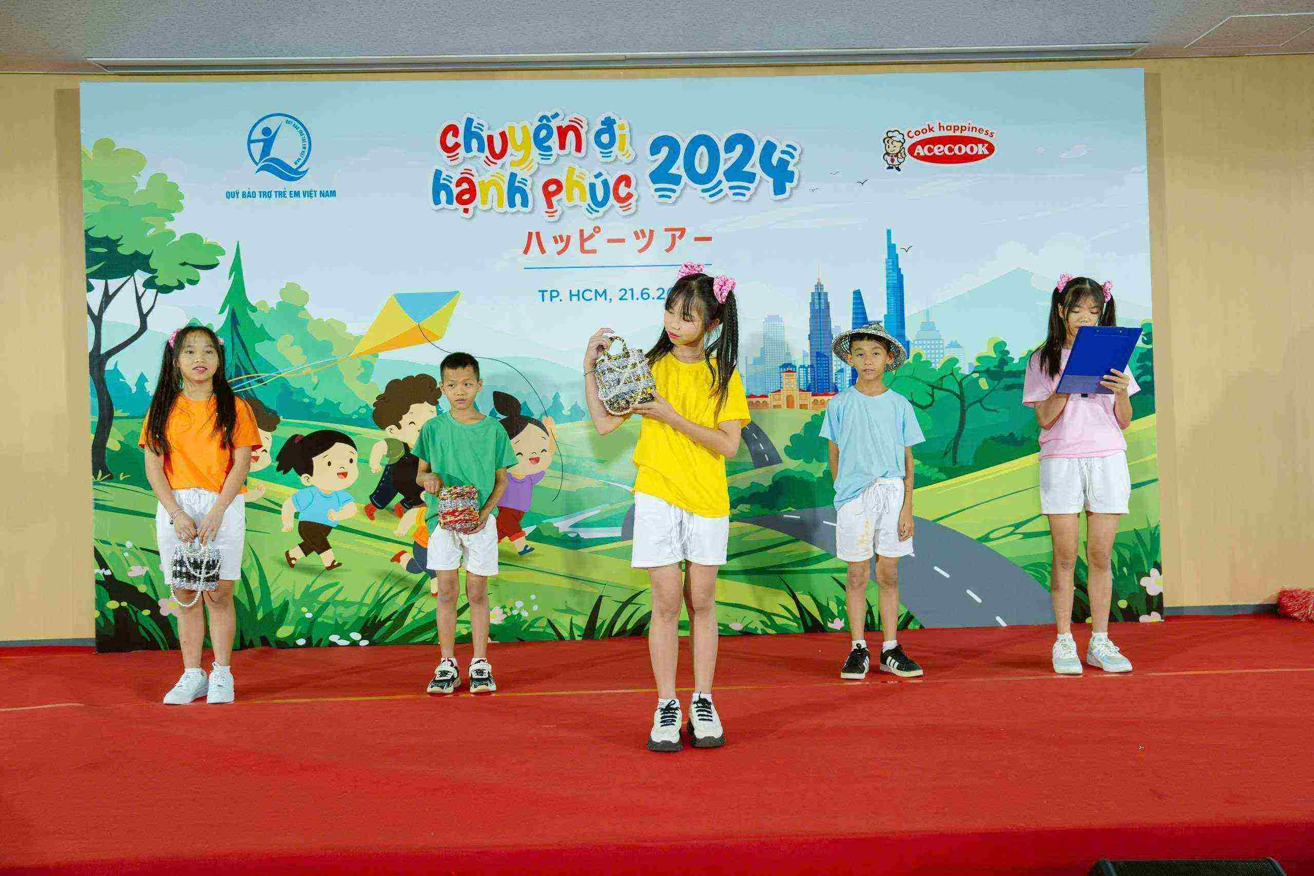 Elementary students performing at an Acecook event