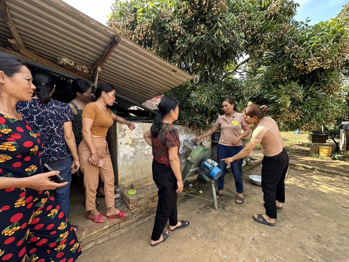 Women coffee workers receiving workplace safety training on farm equipment