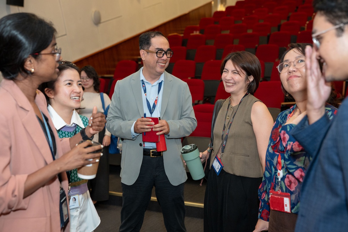 RMIT academics and staff chat with Mr Kim during the event