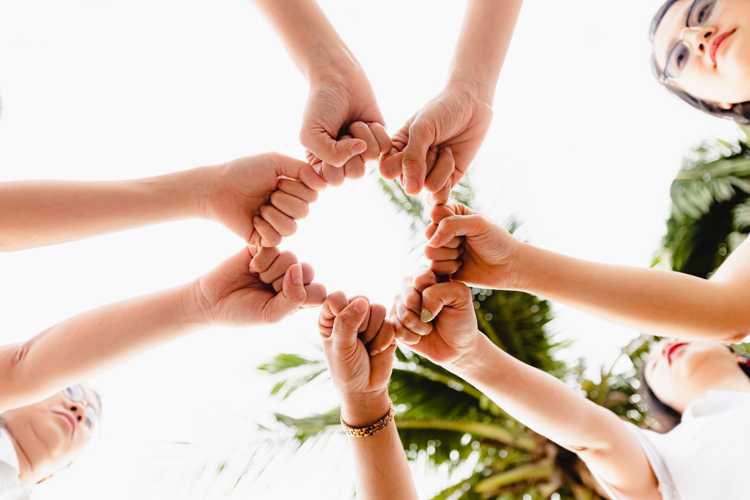 TFV's fellows forming a circle with joined hands symbolising teamwork
