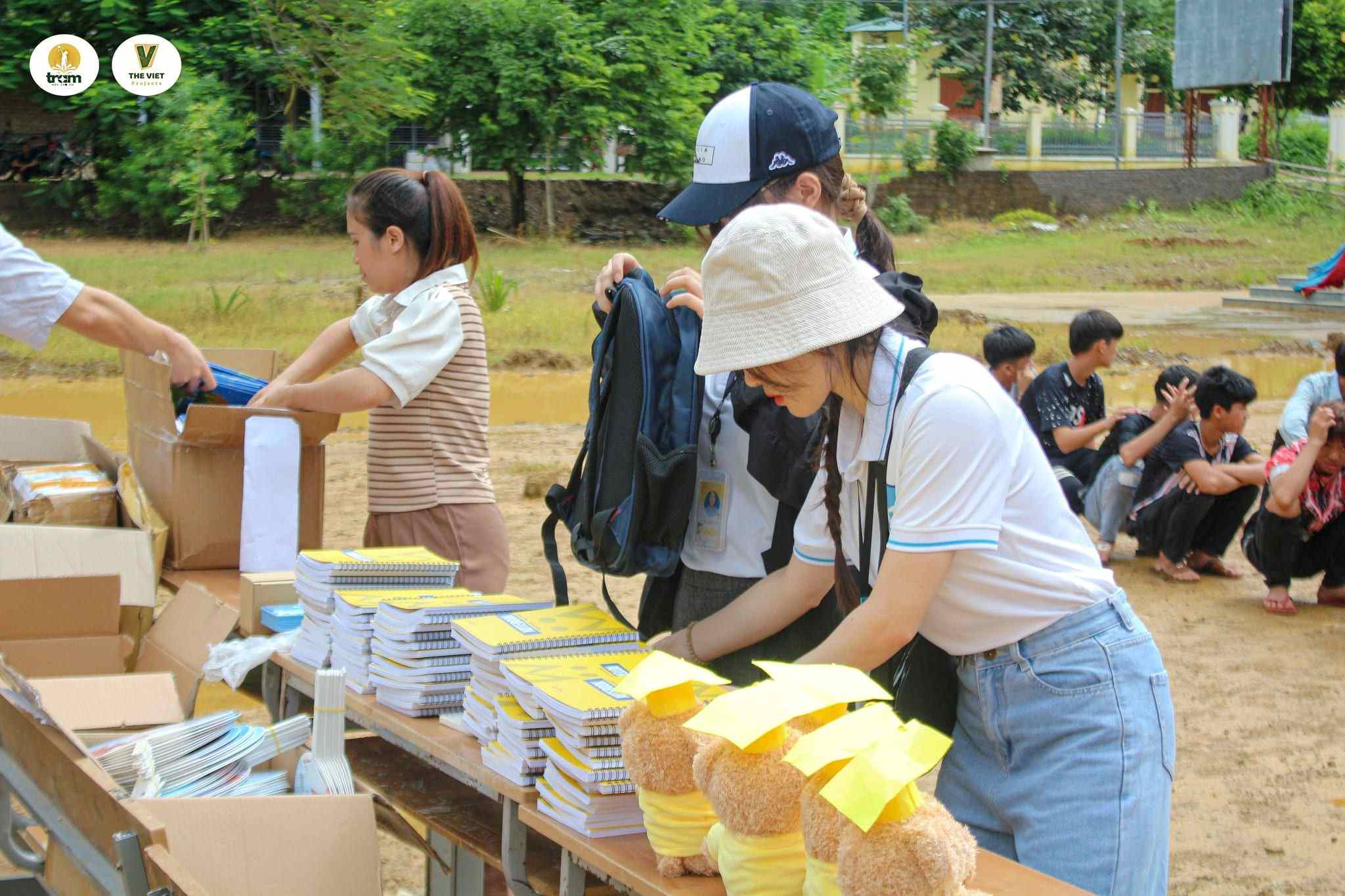 Staff arranging stationery gifts for students