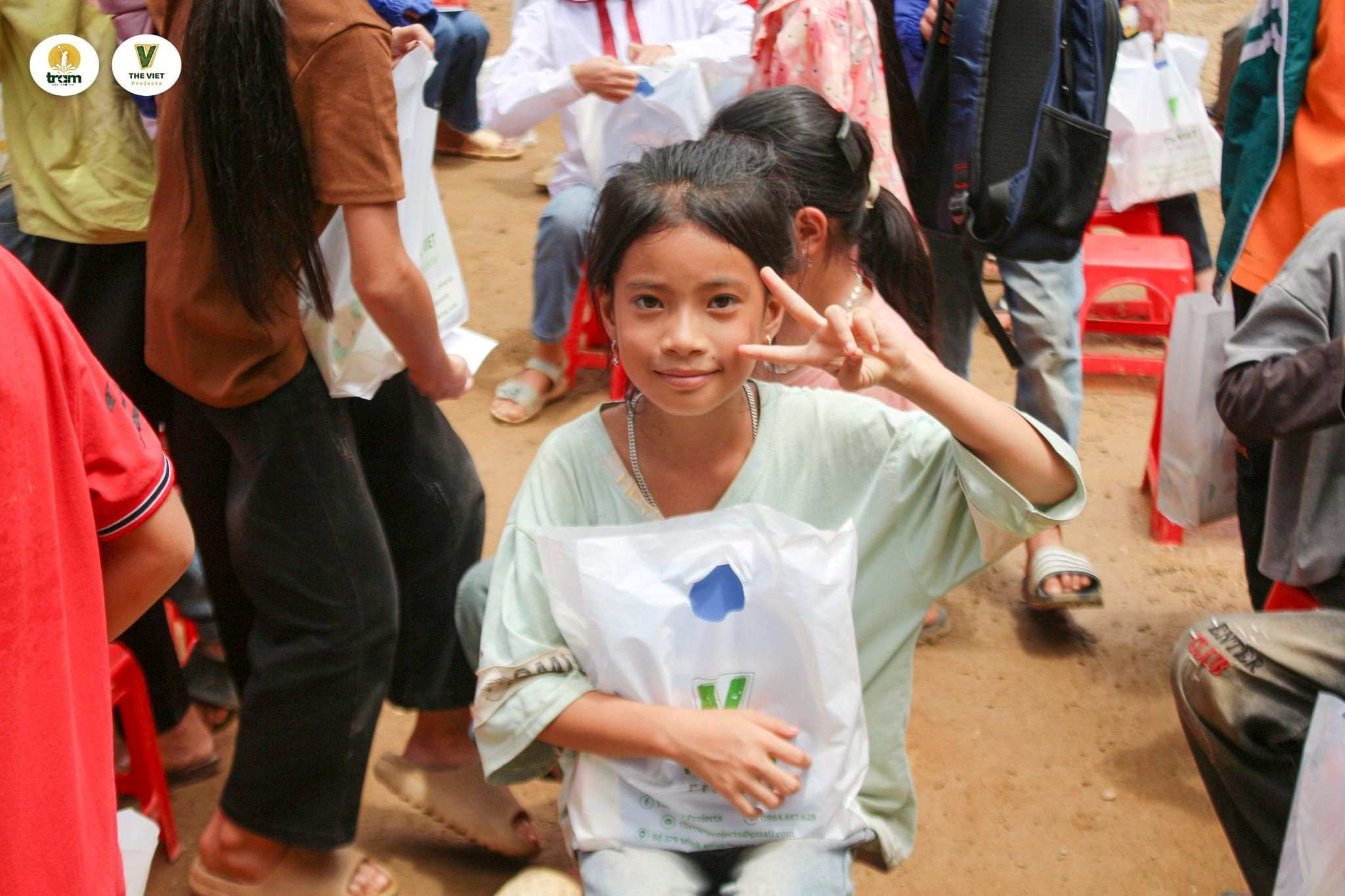 Child with gift bag at event.