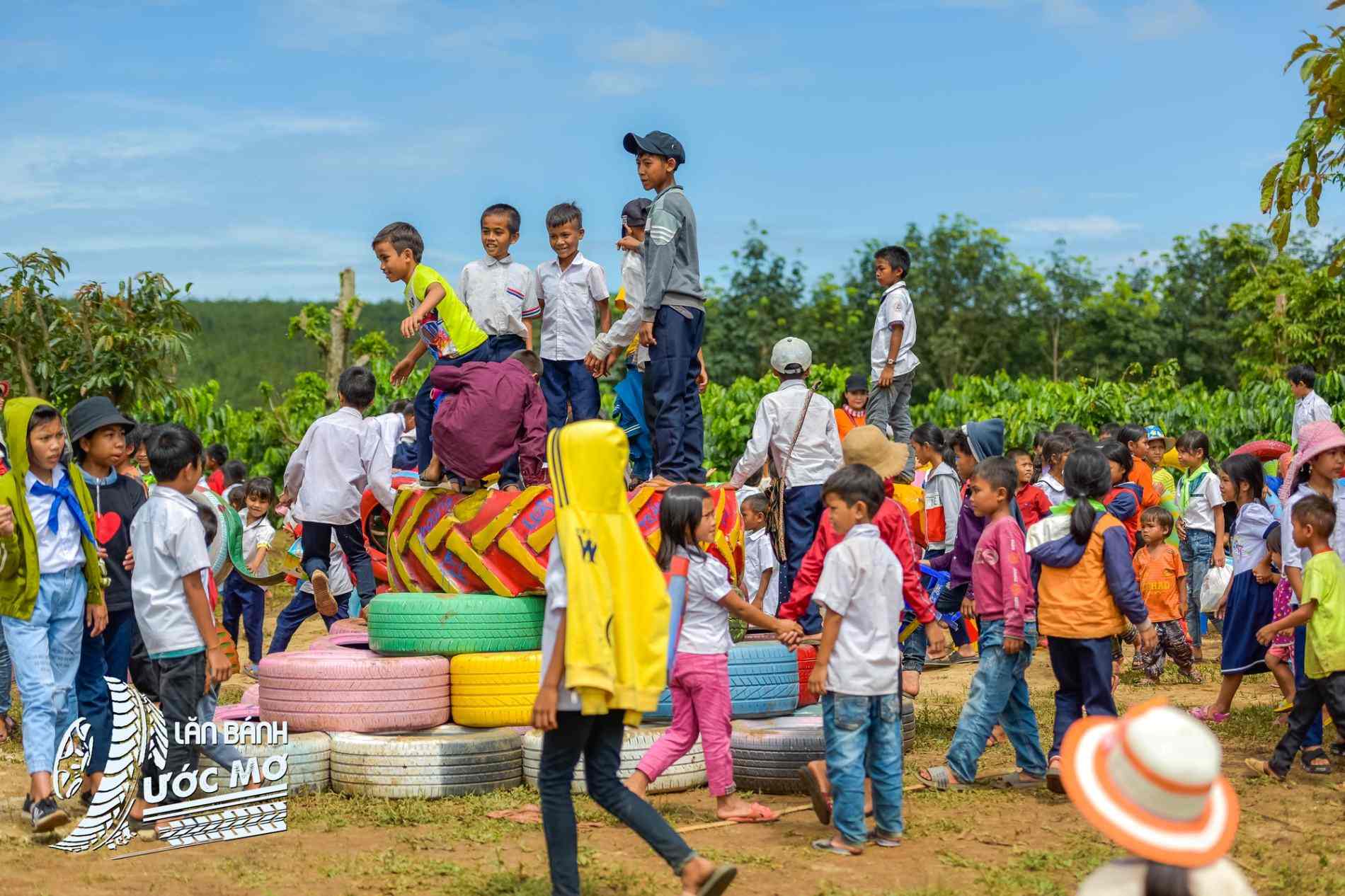 Crowds of children enjoying a Wheel of dreams playground