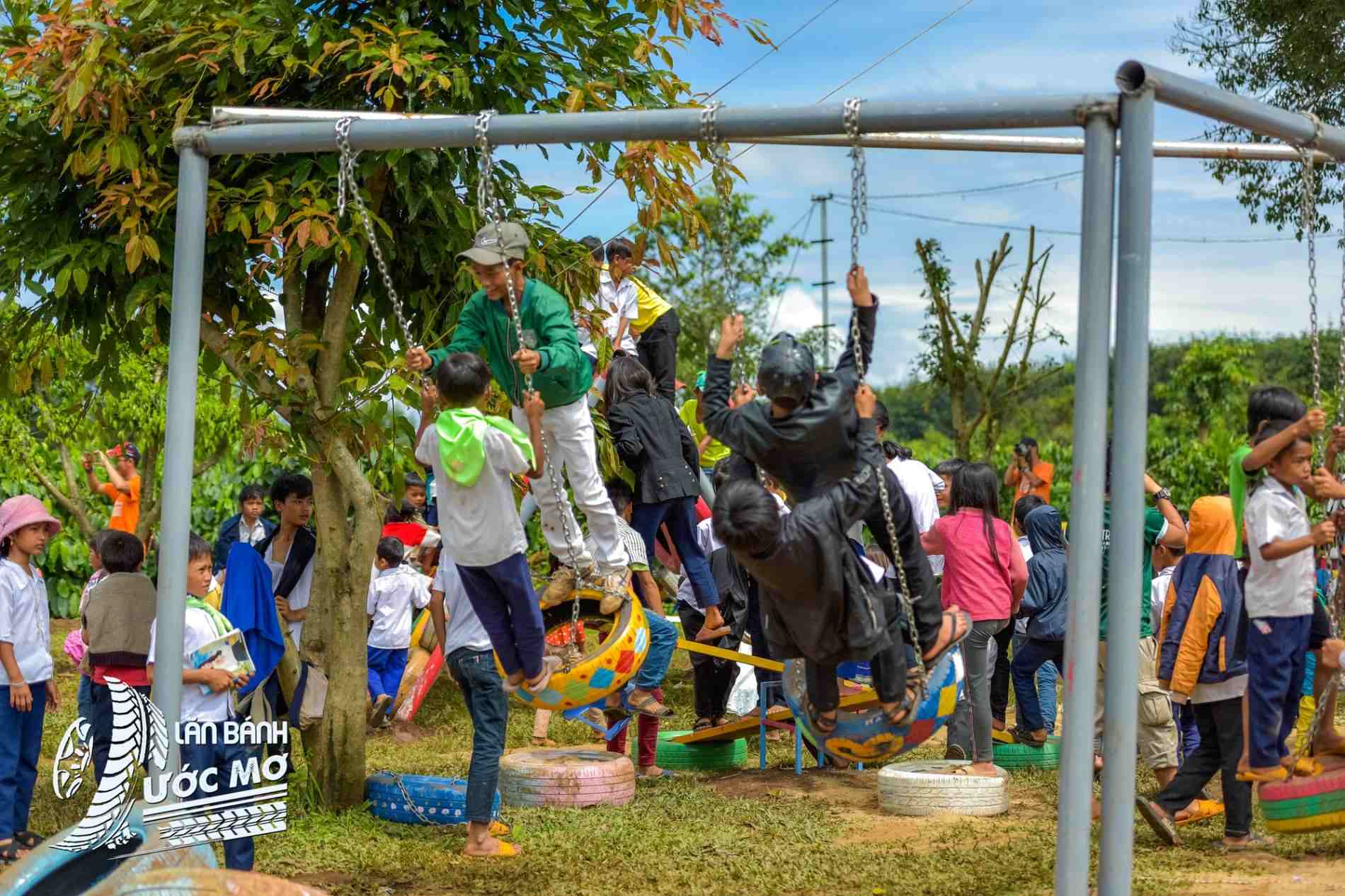 Children playing at the Wheel of Dreams community playground