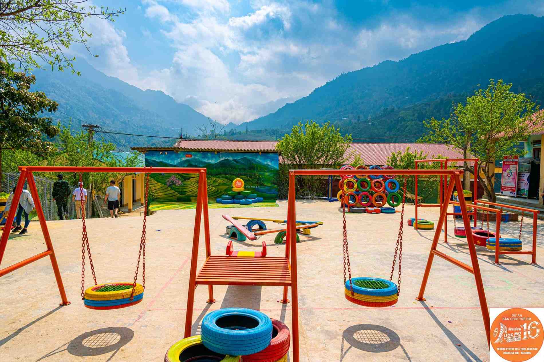 Wheel of dreams playground with recycled tyre swings in the mountains