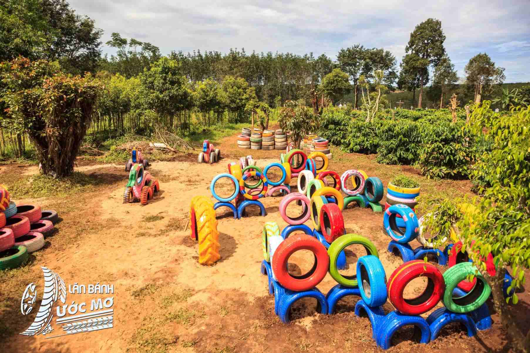 Colourful Wheel of dreams playground made from recycled tyres
