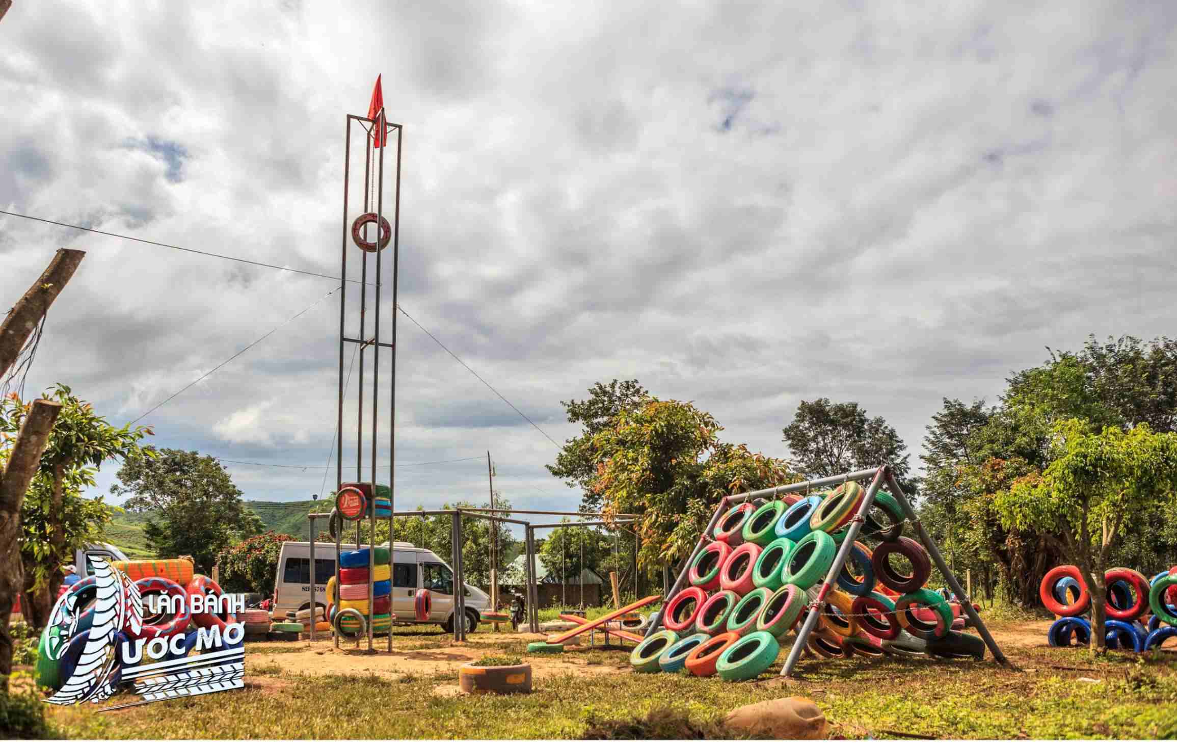 Wheel of dreams playground with tower and tyre climbing frames