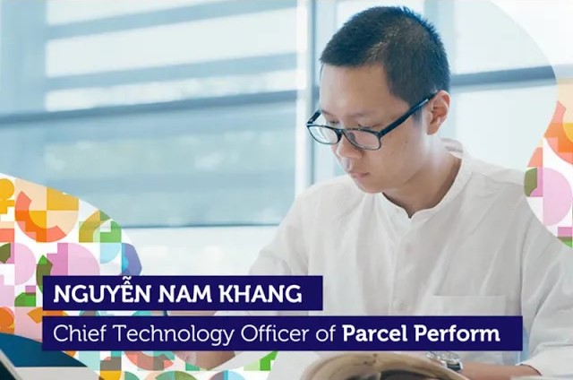 an Asian male working on his computer