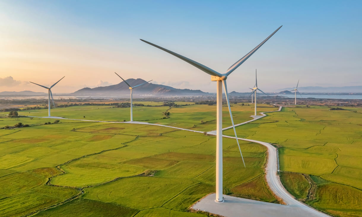 Photo of a panoramic view of wind farm or wind park, with high wind turbines for generation electricity, taken in Ninh Thuan, Vietnam