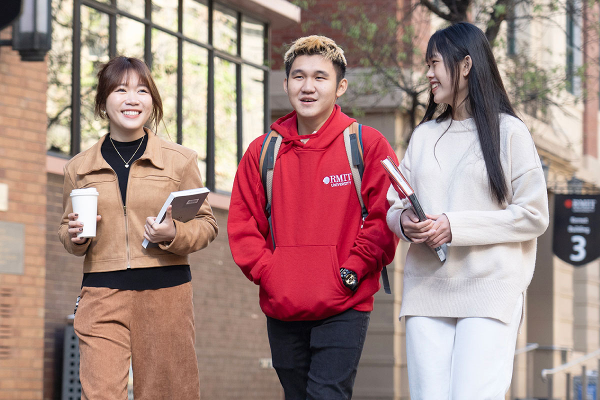 three-university-students-walking-chatting-1200x800.jpg