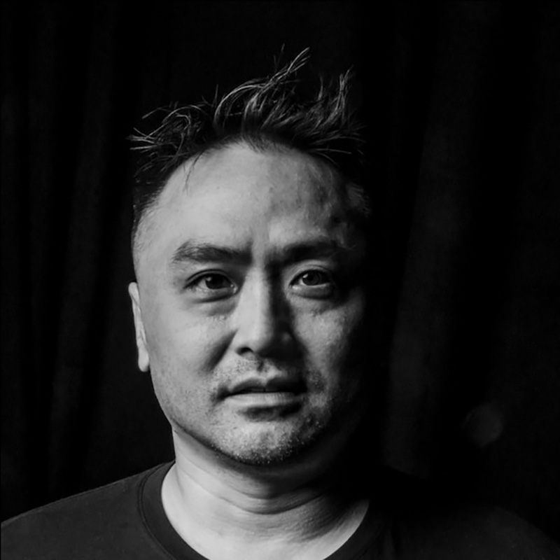 a headshot of an asian man