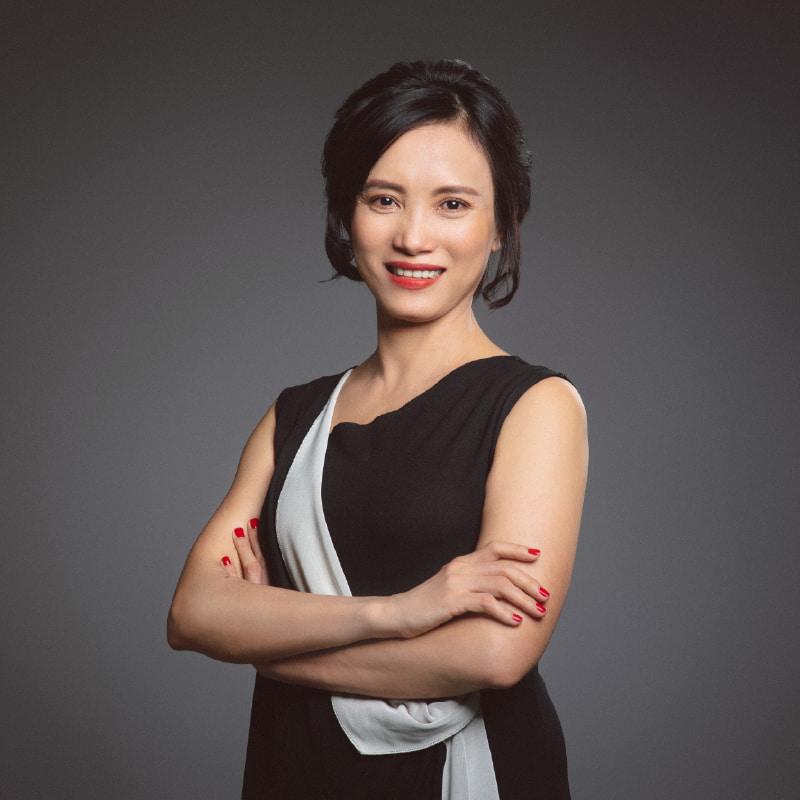 a headshot of a woman smiling 