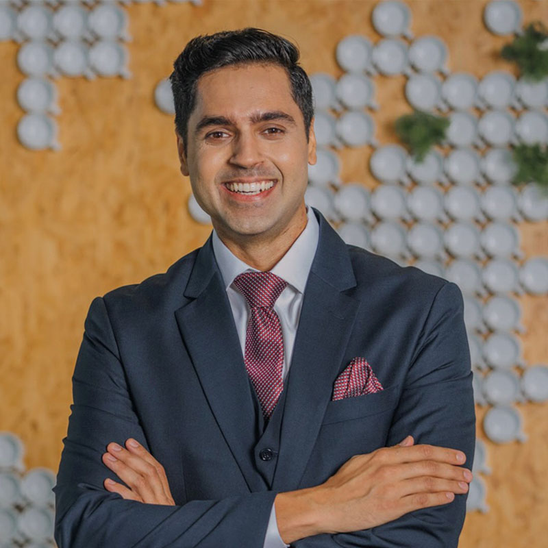 headshot of a man smiling