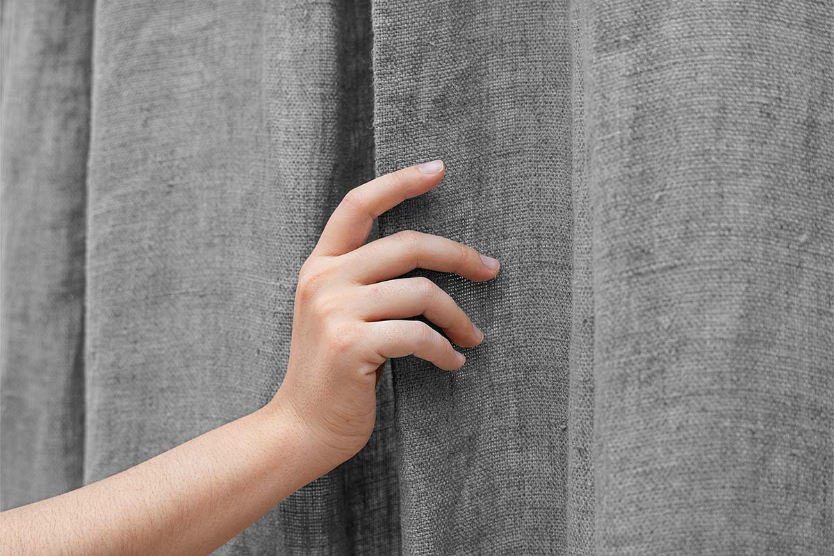 hand-on-curtain.jpg