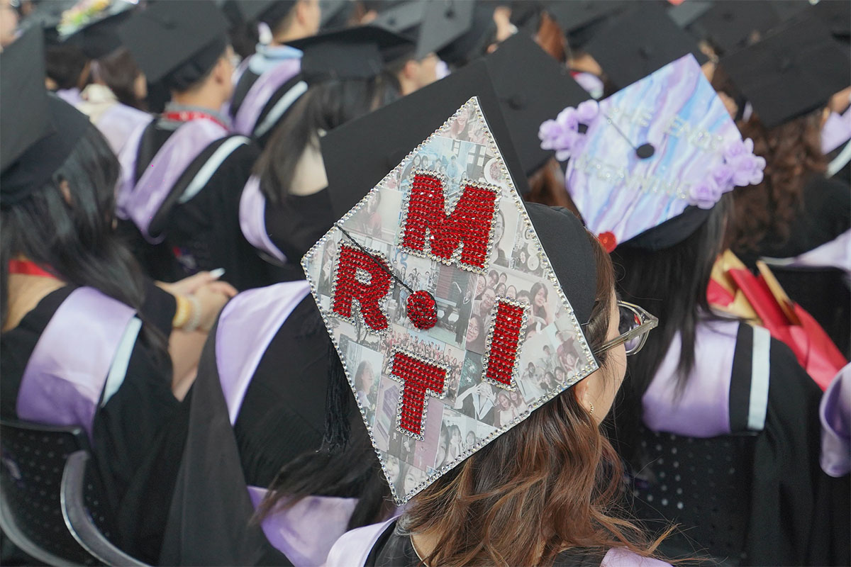 female-student-with-a-bedazzled-rmit-text-decorated-graduation-hat.jpg