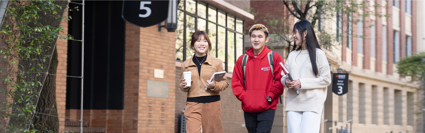 three-university-students-walking-chatting.jpg