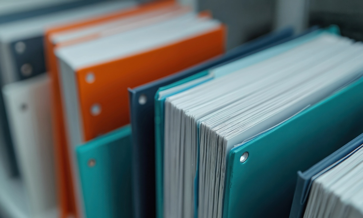 close of image of cyan and orange books