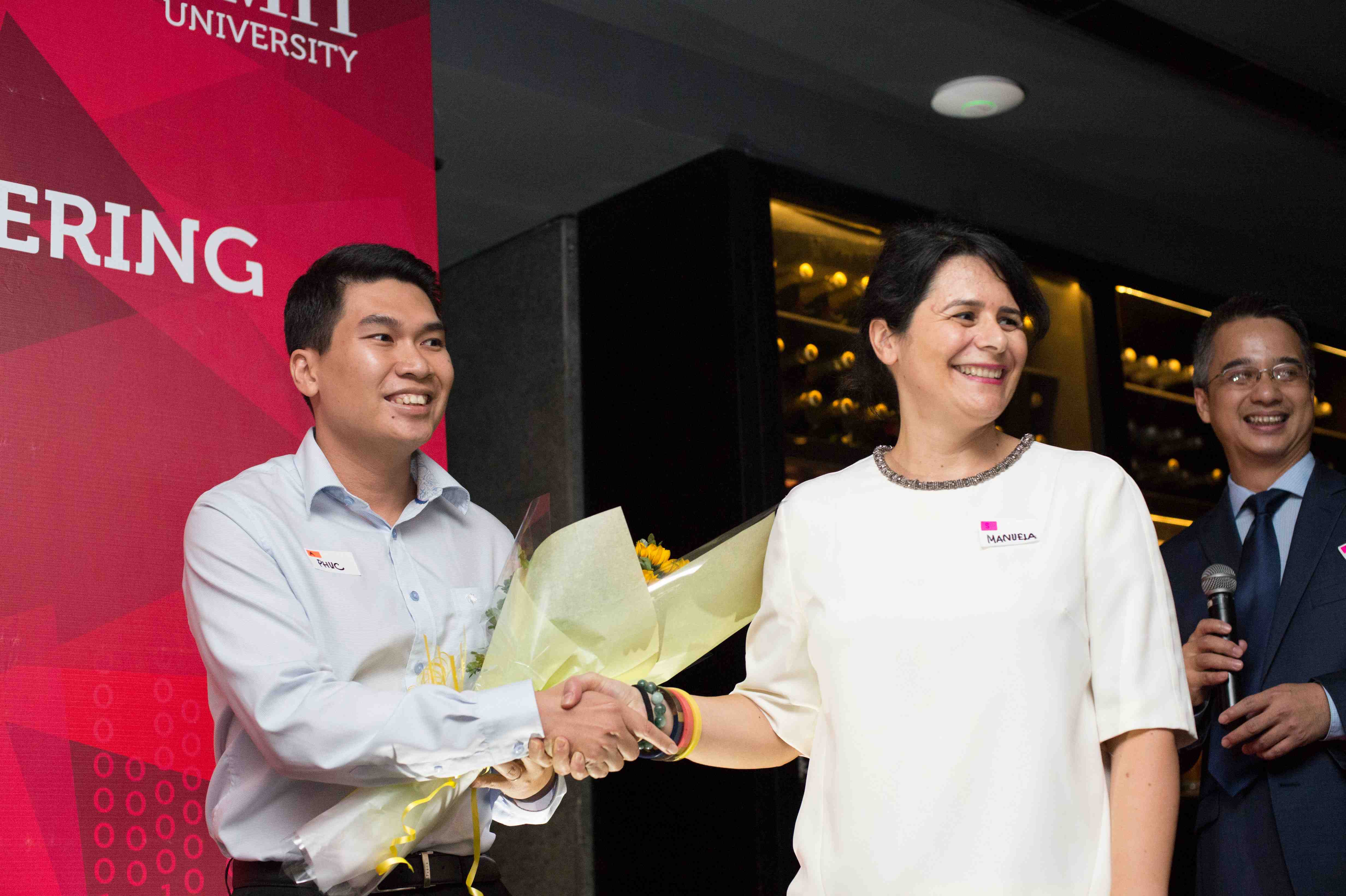 Manuela Spiga (middle), Senior Manager Careers and Employability Service, welcomes alumnus Nguyen Hoang Phuc (left) to the alumni chapter executive board.