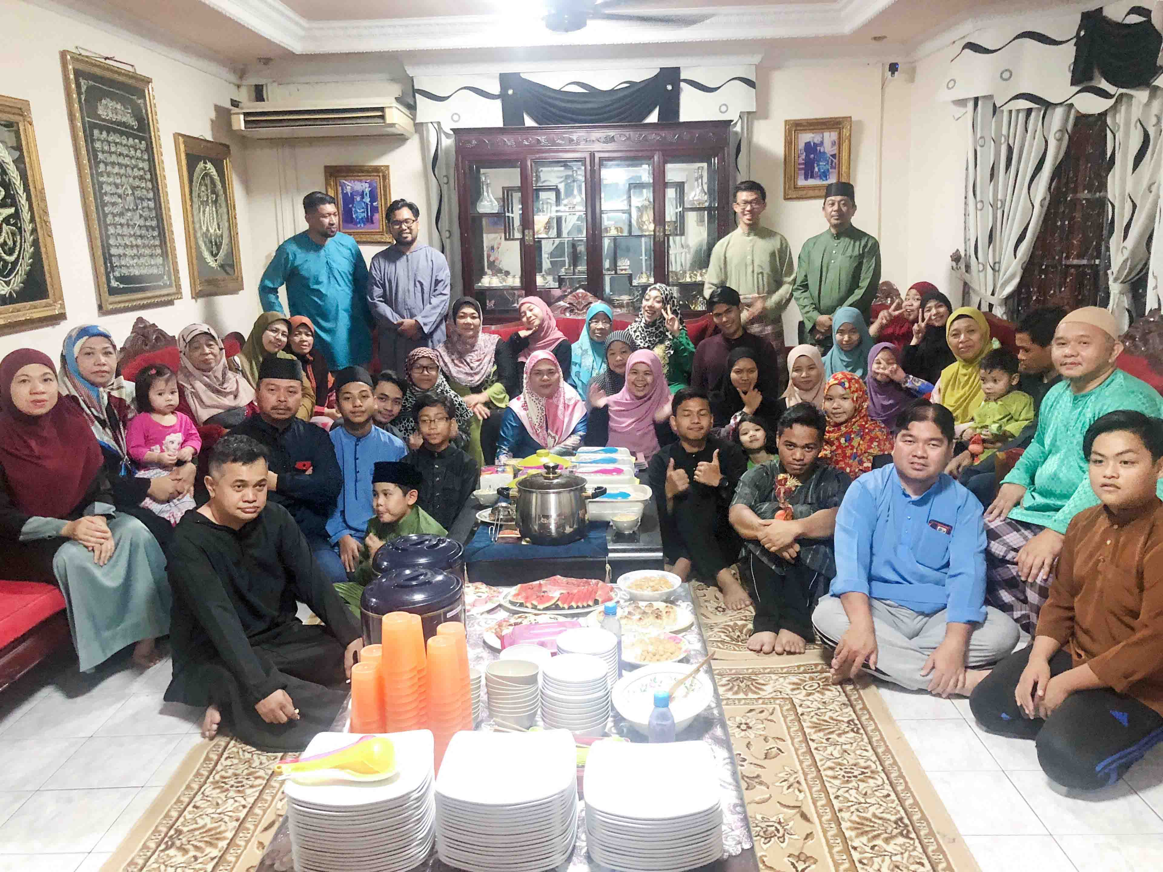 Hieu pictured with his four-generation host family in Brunei