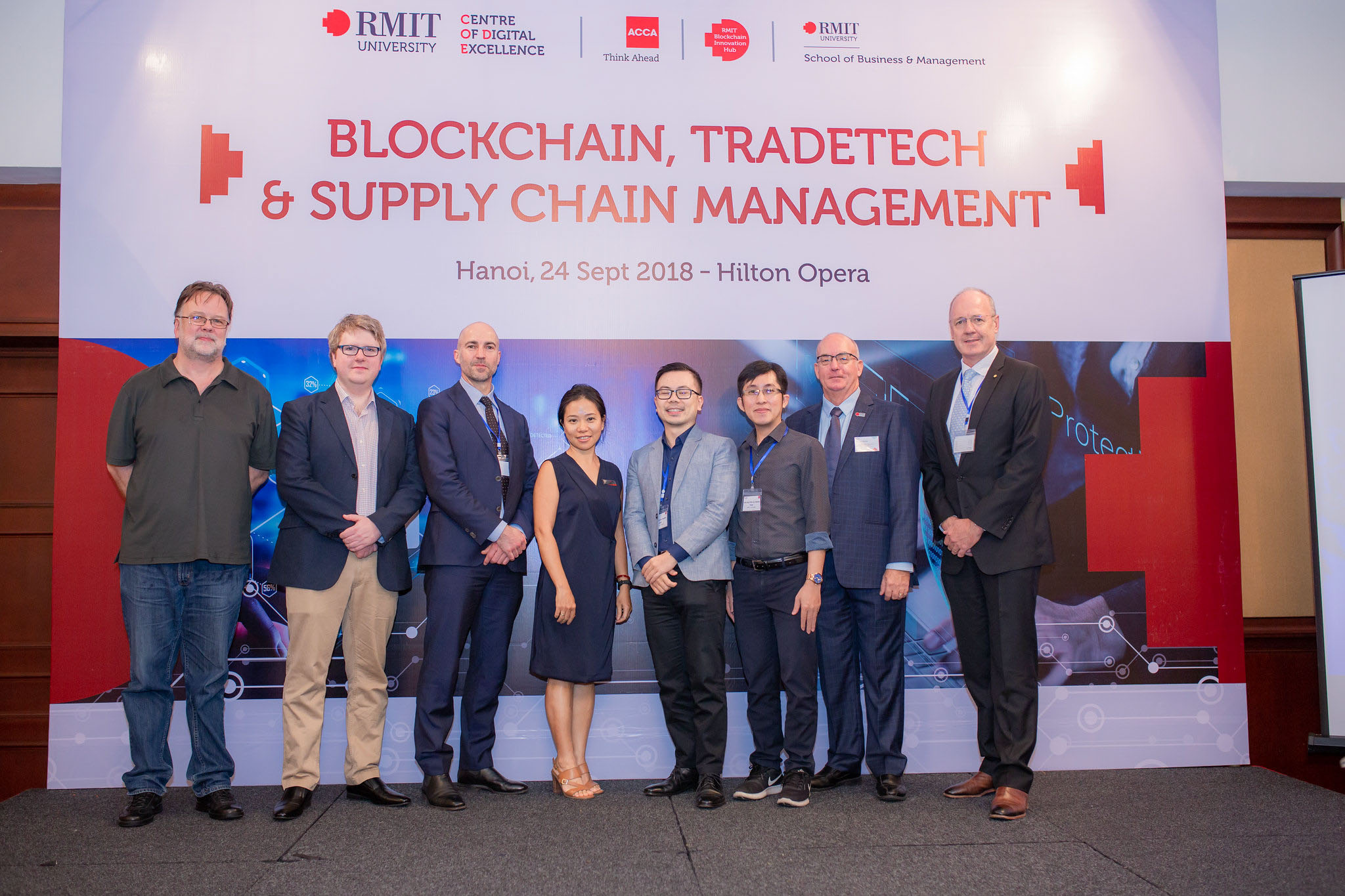 BIH Senior Research Fellow Dr Christopher Berg (pictured 2nd from left), BIH director Professor Jason Potts (pictured 3rd from left), CODE Senior Coordinator Yen Huynh (pictured 4th from left), Dr Binh Nguyen (pictured 4th from right) and Dr Thai Nguyen (pictured 3rd from right) at the event, Blockchain, Tradetech & Supply Chain Management held in Hanoi last year.