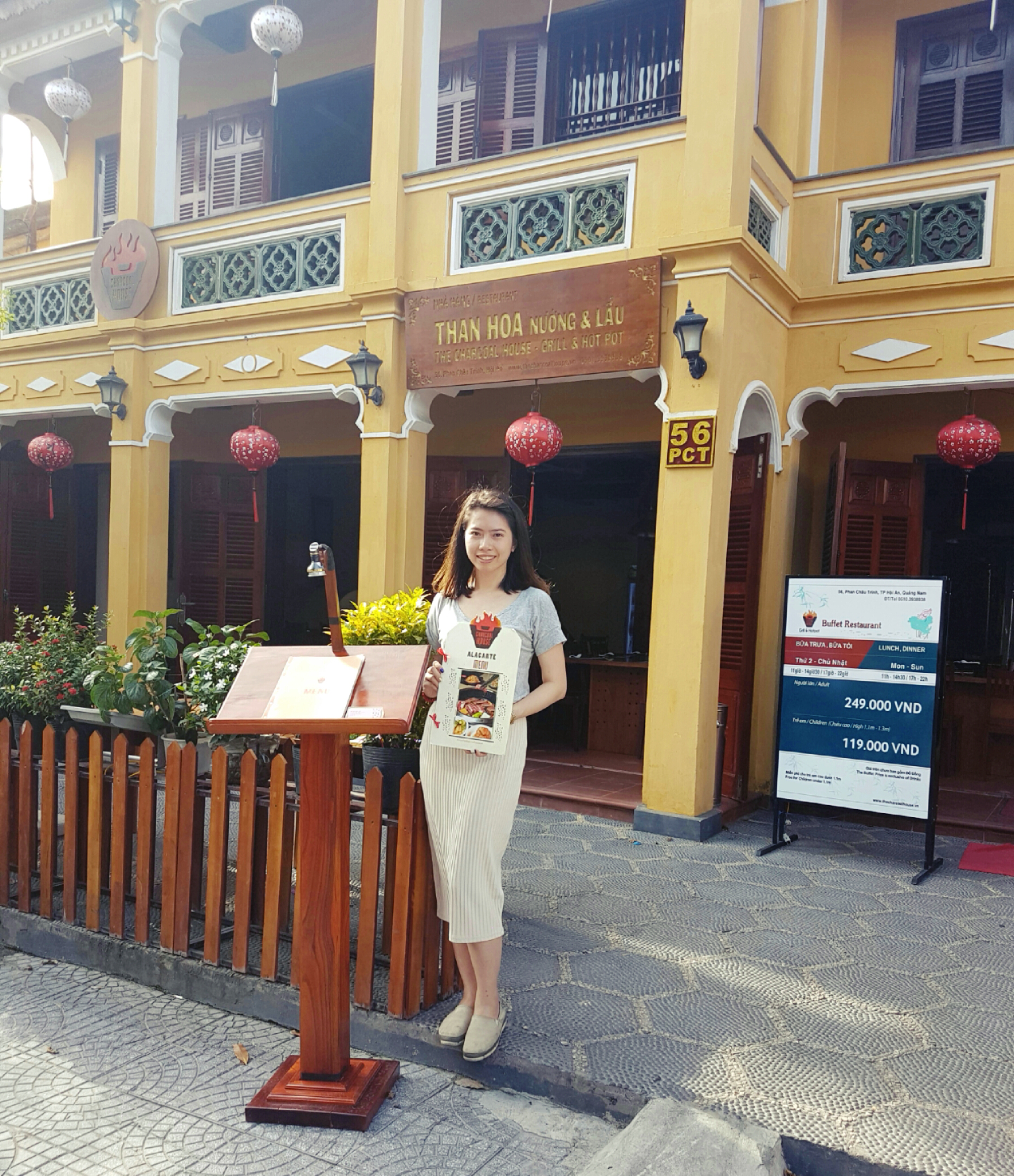 Nguyen Mai Trang shows off The Charcoal House's menu