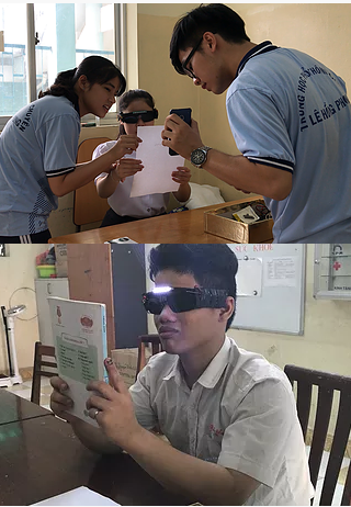 Visually impaired students trying on NeoEyes smart glasses.  