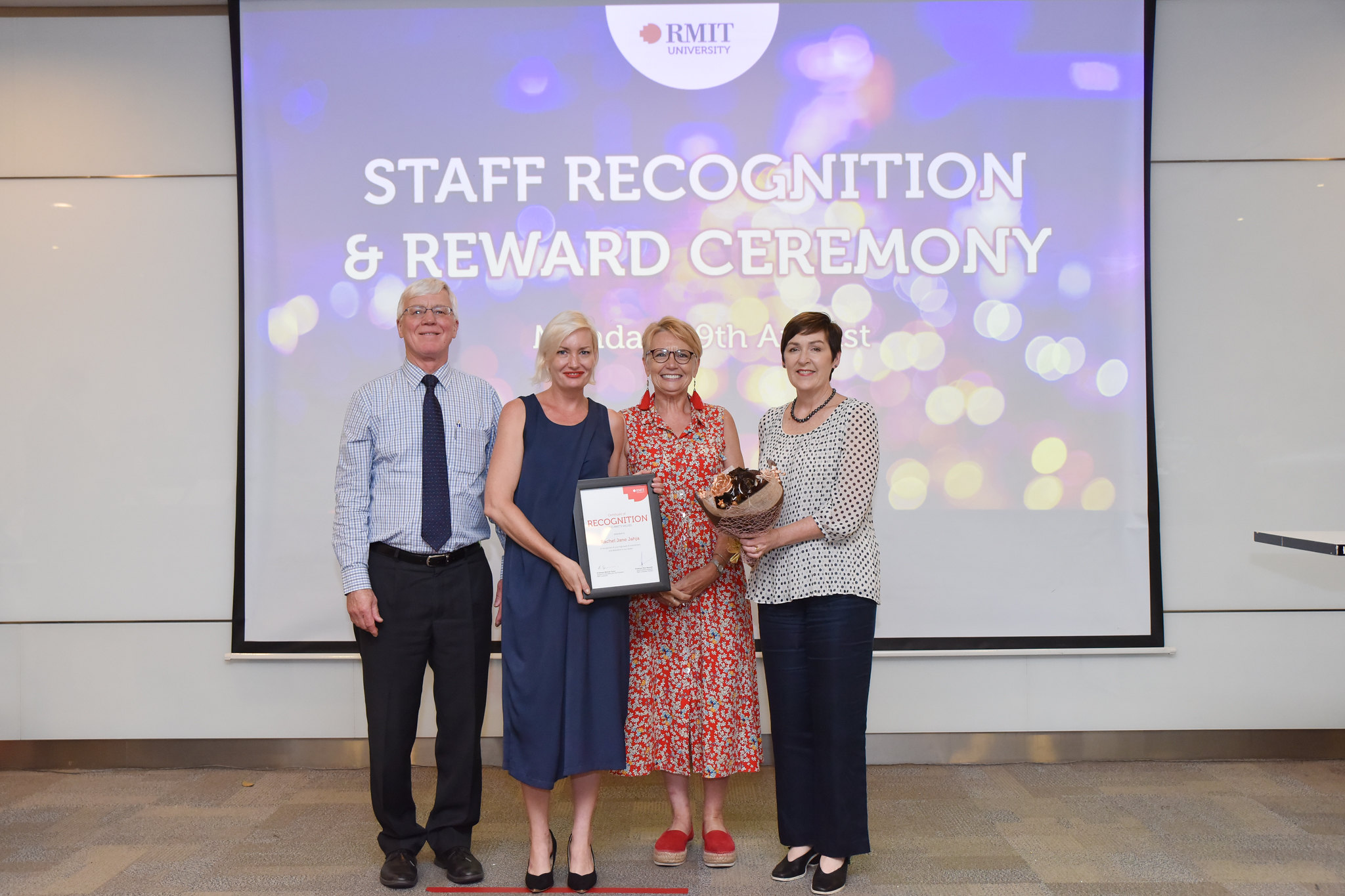 Associate Lecturer Rachel Jahja (second from left) accepts her Living with RMIT’s Values Award at RMIT’s Staff Recognition & Reward Ceremony. 