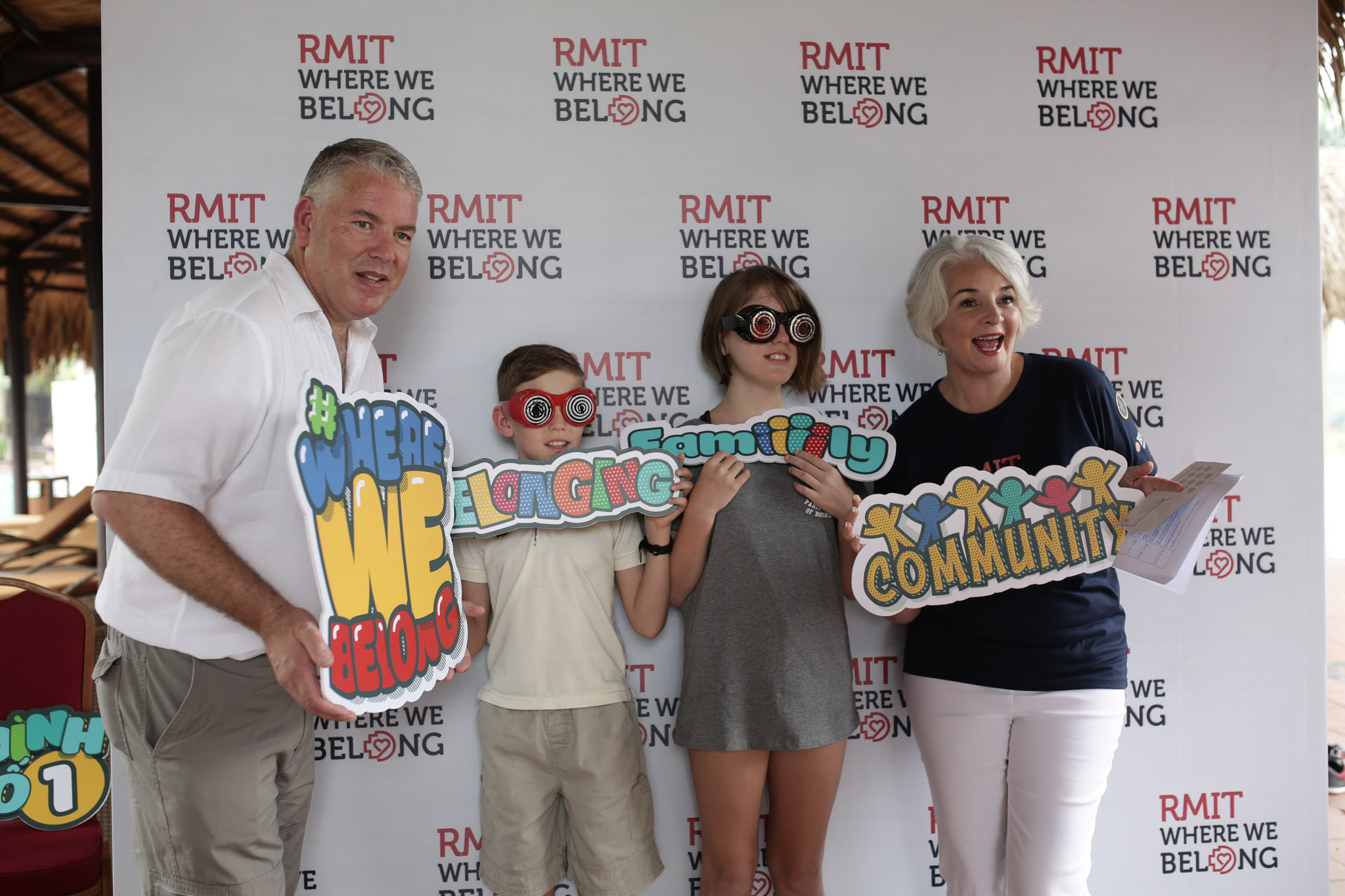 President Professor Gael McDonald and her family take a photo at the ‘Where We Belong’ booth.