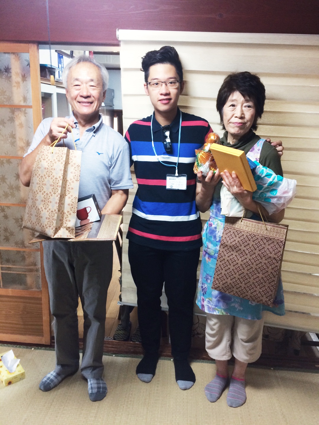 Vinh Bao and his “adoptive parents” in Japan.