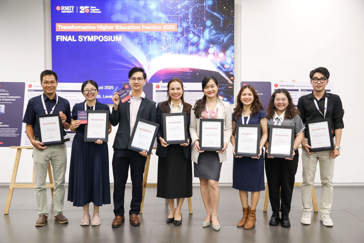 Group of eight people holding certificates
