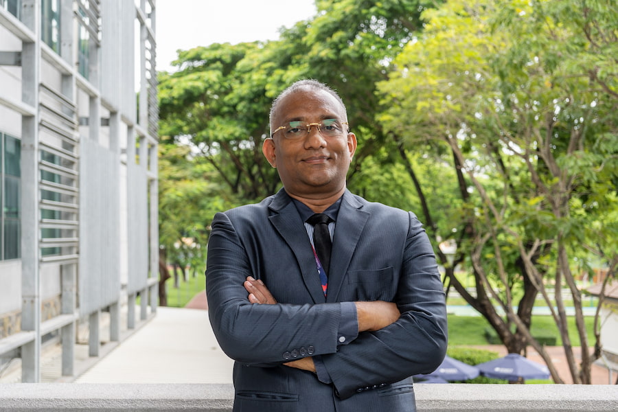 Dr Majo George posing with crossed arms