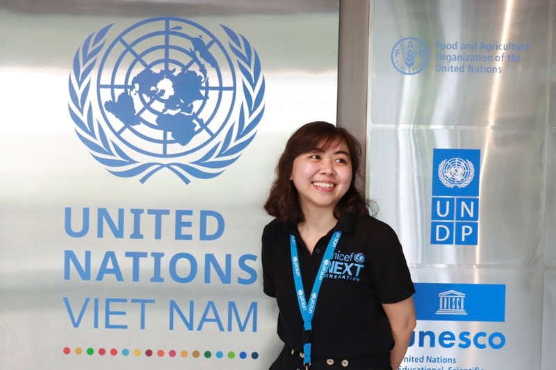 Duc Anh in front of the UN Vietnam sign