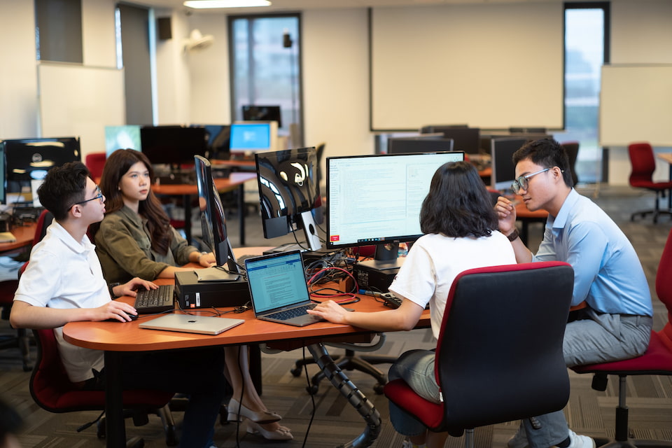 Four students in a computer lab