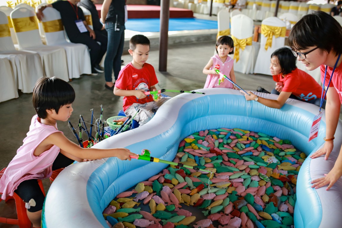 Children enjoy a fishing game, one of the many activities on offer during the day.