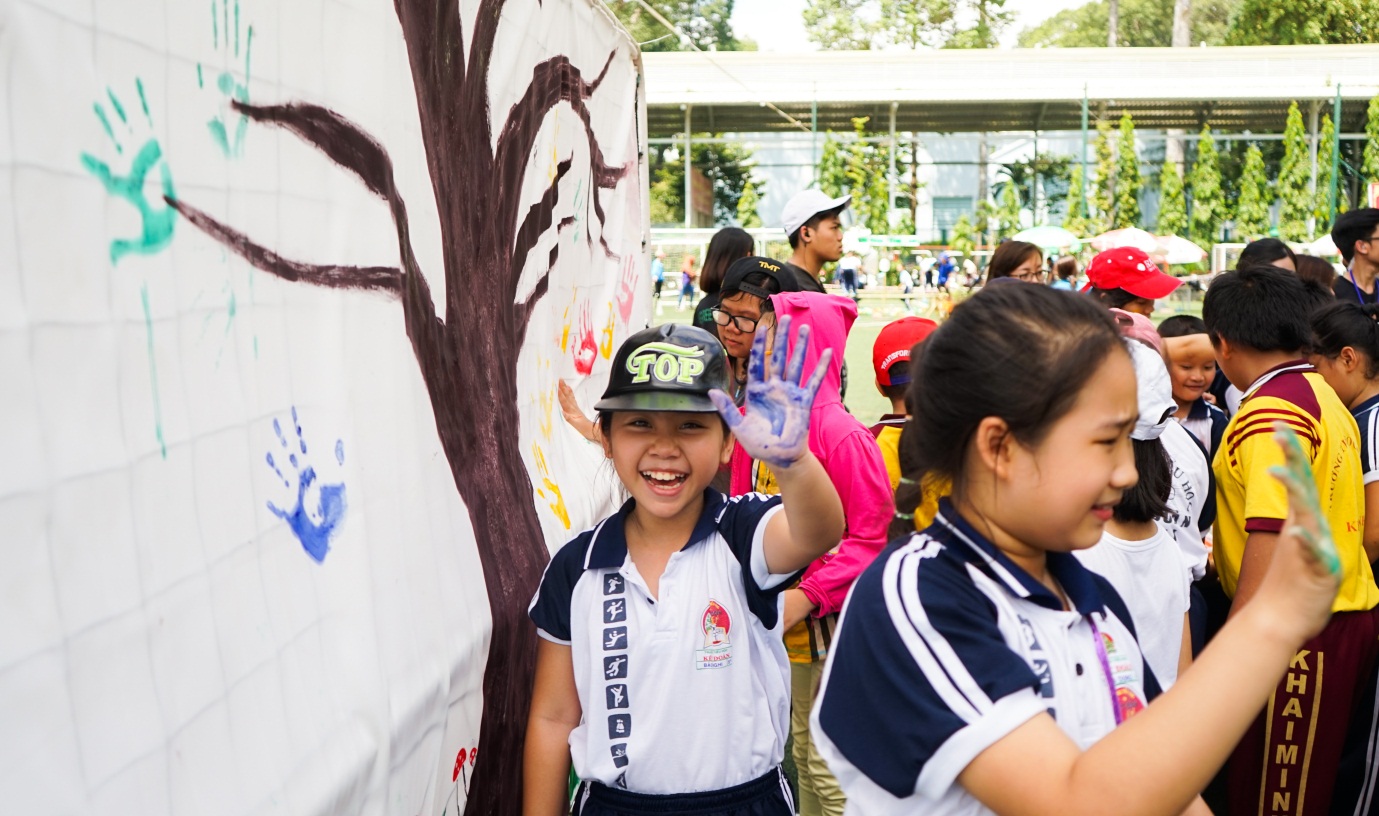 Green Fair – Participants at the Green Fair use their hand prints to create an ‘environmental’ tree