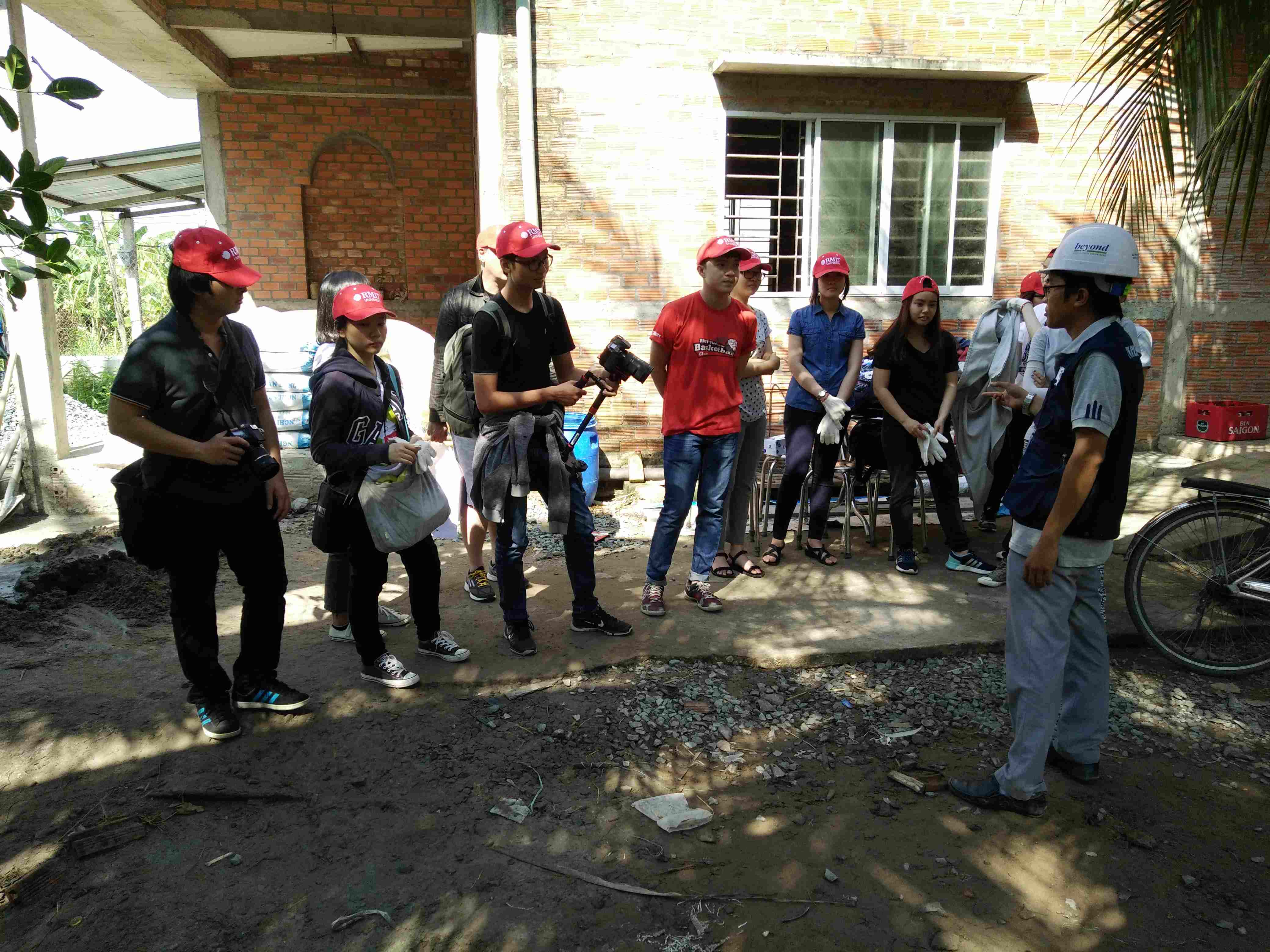 Bachelor of Design (Digital Media) students prepare to build a house in the Mekong Delta. 