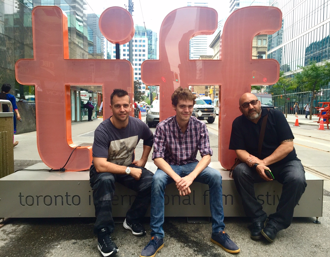 Robert Corrigan (left) sits alongside his team from Wirrin Media outside the Toronto Film Festival in Canada.