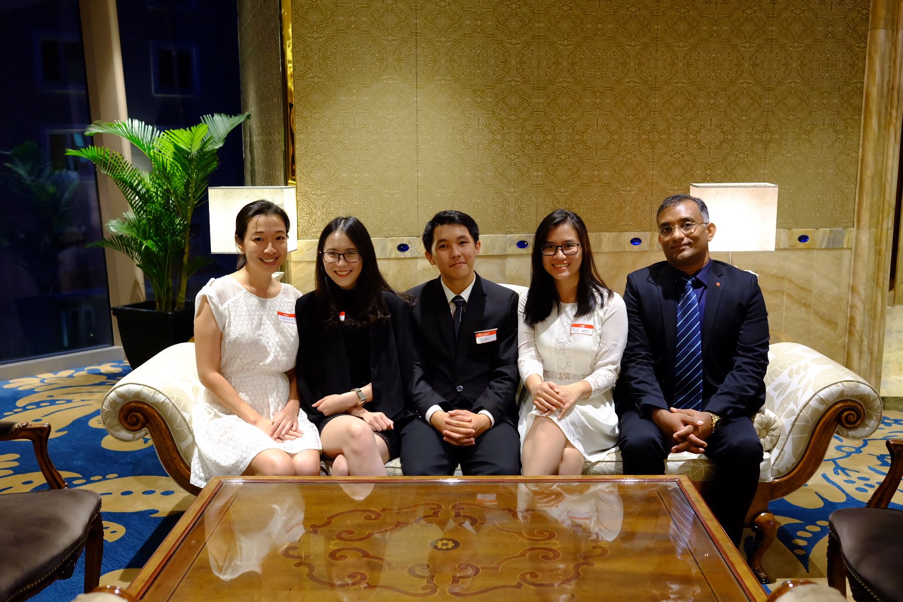 The winning team members with School of Business lecturers Narumon Sriratanaviriyakul (left) and Majo George (right). 