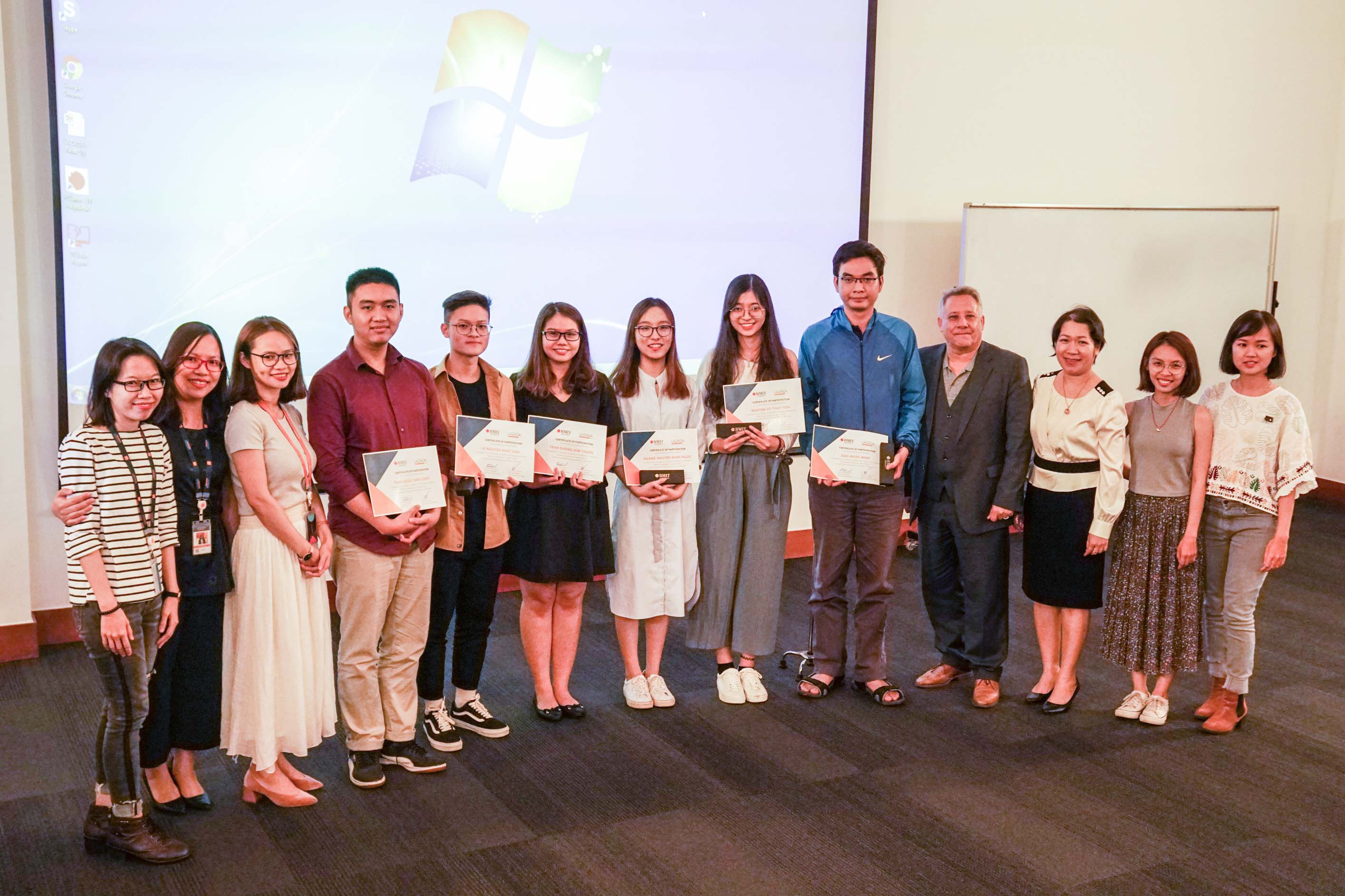 Representatives from Lazada’s Online Marketing team, Nguyen Anh Thu (Lecturer and Course Coordinator), Associate Professor Robert McClelland (Head of Department, Management), and the winning team at the pitching session.