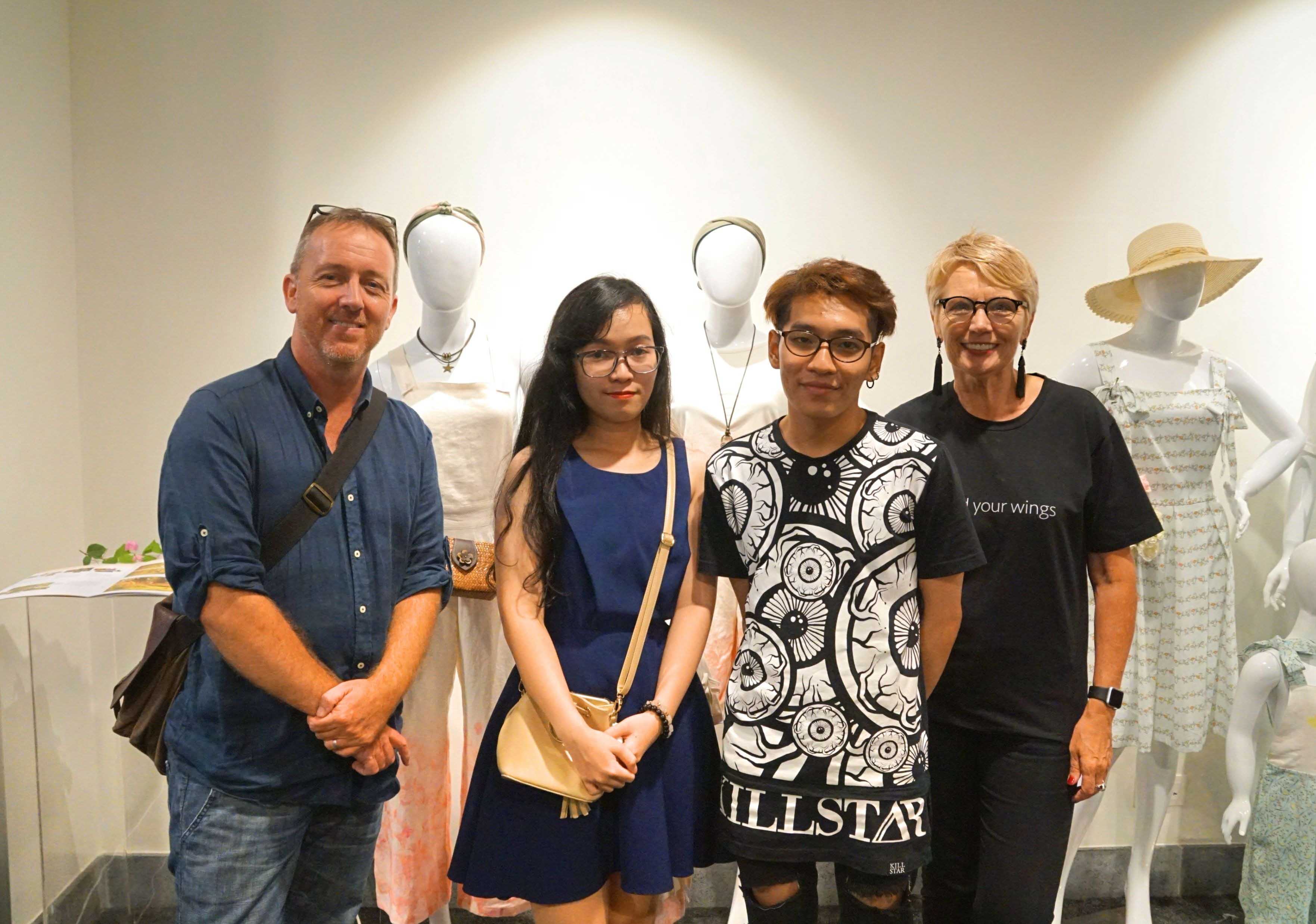 Jason Gibaud, and fashion students Dang Ngoc Tram and Nguyen Hong Anh, and Julia Gaimster pose in front of the students’ Mummy and Me clothing line.