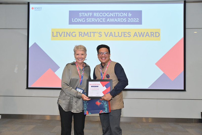 Dean of School of Communication & Design (SCD) giving a Living RMIT’s Values Award to Dr Soumik Parida, SCD Lecturer. 