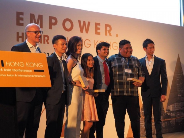 Tran (third from left) and other HPAIR delegates awarded for winning their Entrepreneurship and Technology Impact Challenge.