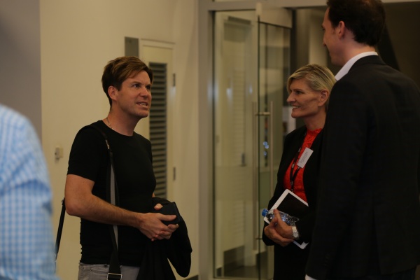 Associate Professor Mark Pegrum (left) networked with academic staff from RMIT Vietnam before delivering the lecture.