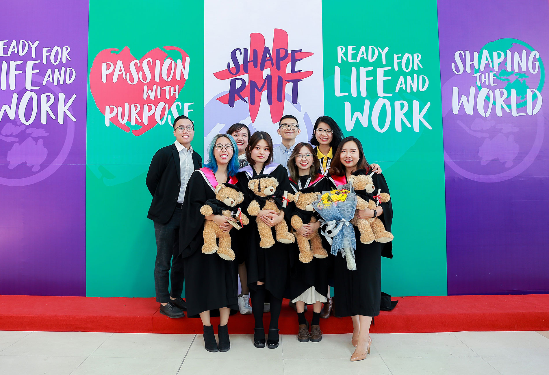 Ngo Phuong Vy (first on the right, front row) with fellow former RED core team members and Student Life staff at Graduation day 2019.