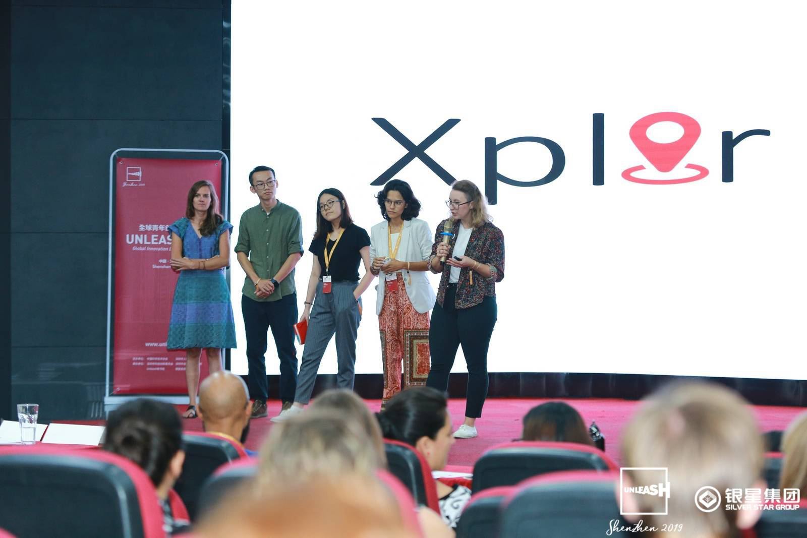 Nguyet (pictured middle) and her team pitching their idea at UNLEASH 2019.