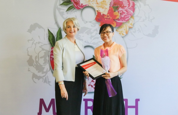 RMIT Vietnam President Professor Gael McDonald (left) presents the doctoral scholarship to Vo Ngoc Thao Nguyen on International Women's Day.