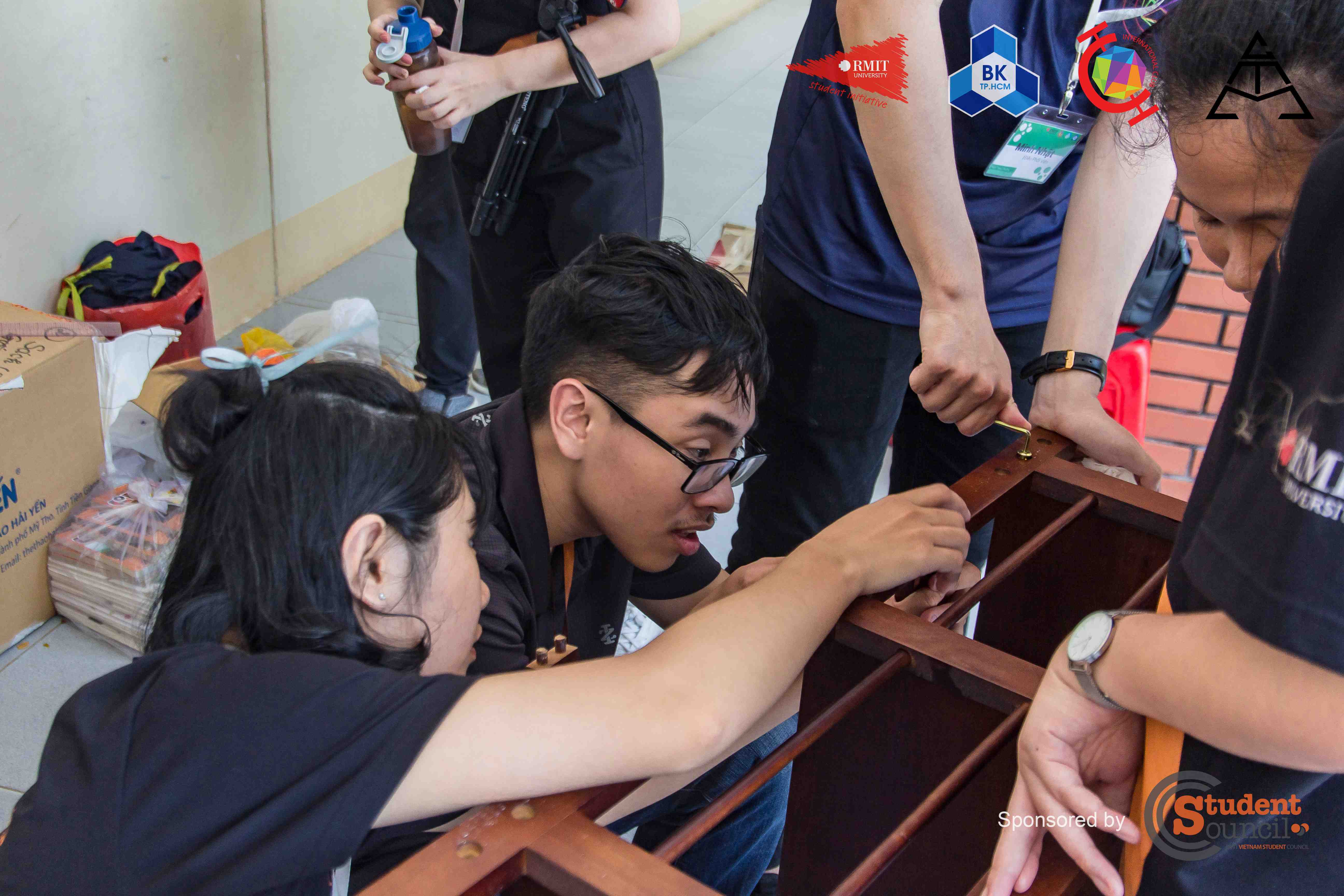 RMIT volunteers assembled bookshelves as a part of the charity project.  