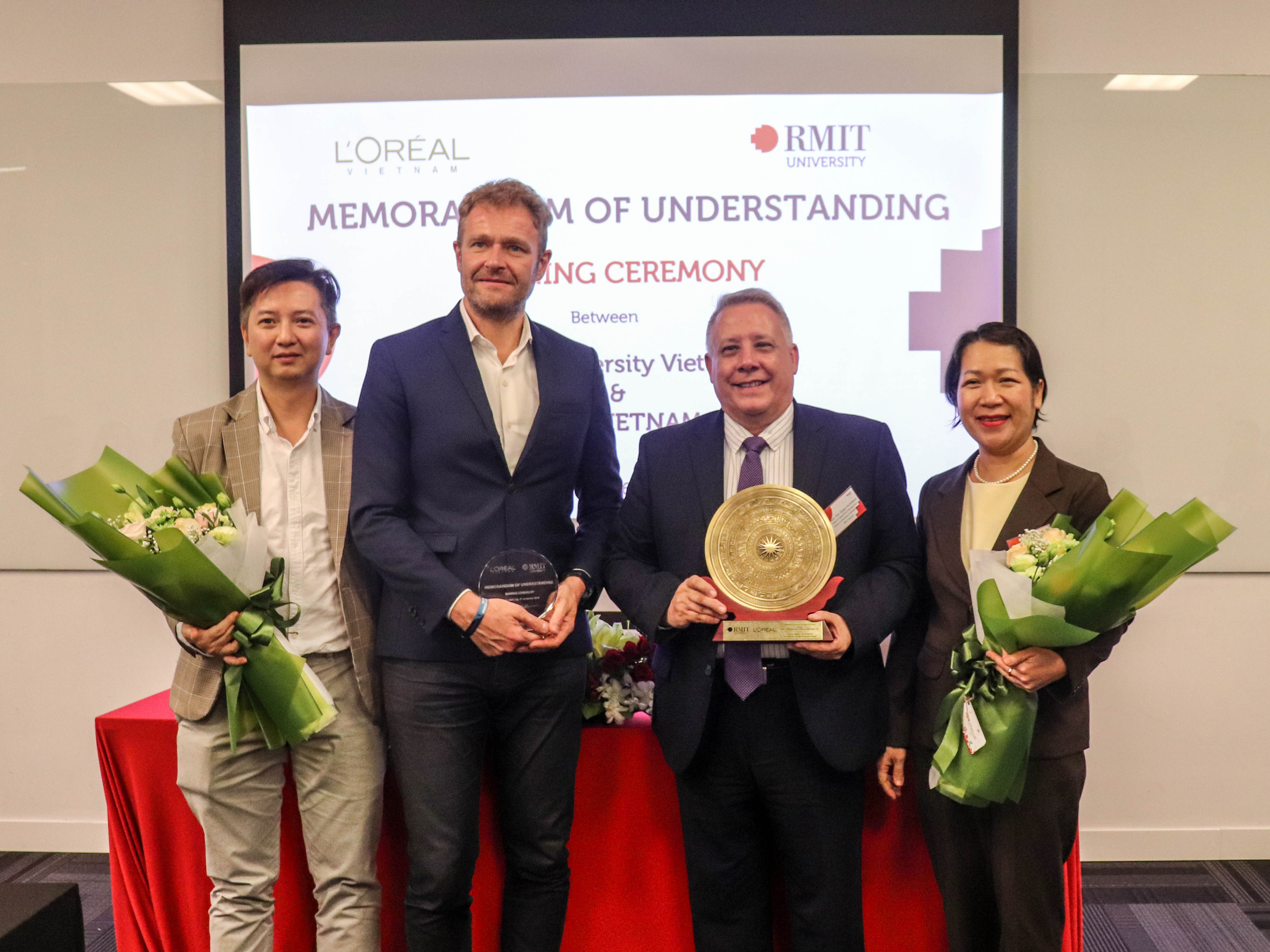 (From left to right) L’Oreal Vietnam Human Resources Director Pham Manh Khoi, L'Oreal Vietnam General Director Valery Gaucherand, RMIT Vietnam Head of Department of Management Associate Professor Robert McClelland, and RMIT Vietnam Lecturer Nguyen Anh Thu at the MoU signing ceremony.