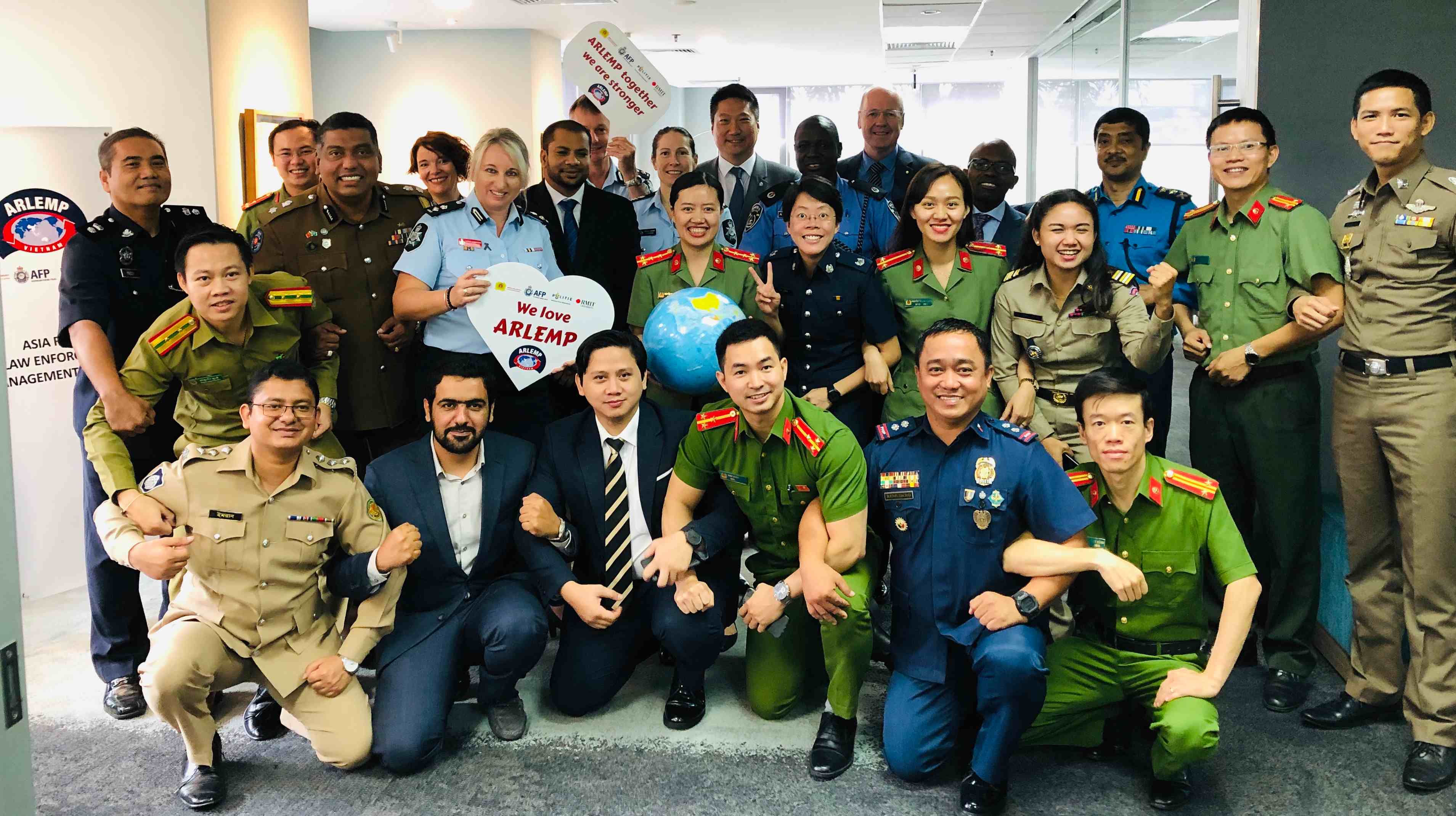 Police officers at the opening of the 48th ARLEMP joined by the ARLEMP partners: Mr Phillip Dowler (RMIT Vietnam), Detective Superintendent Roger Brown (Australian Federal Police), Colonel Le Duc Tuyen (MPS). 